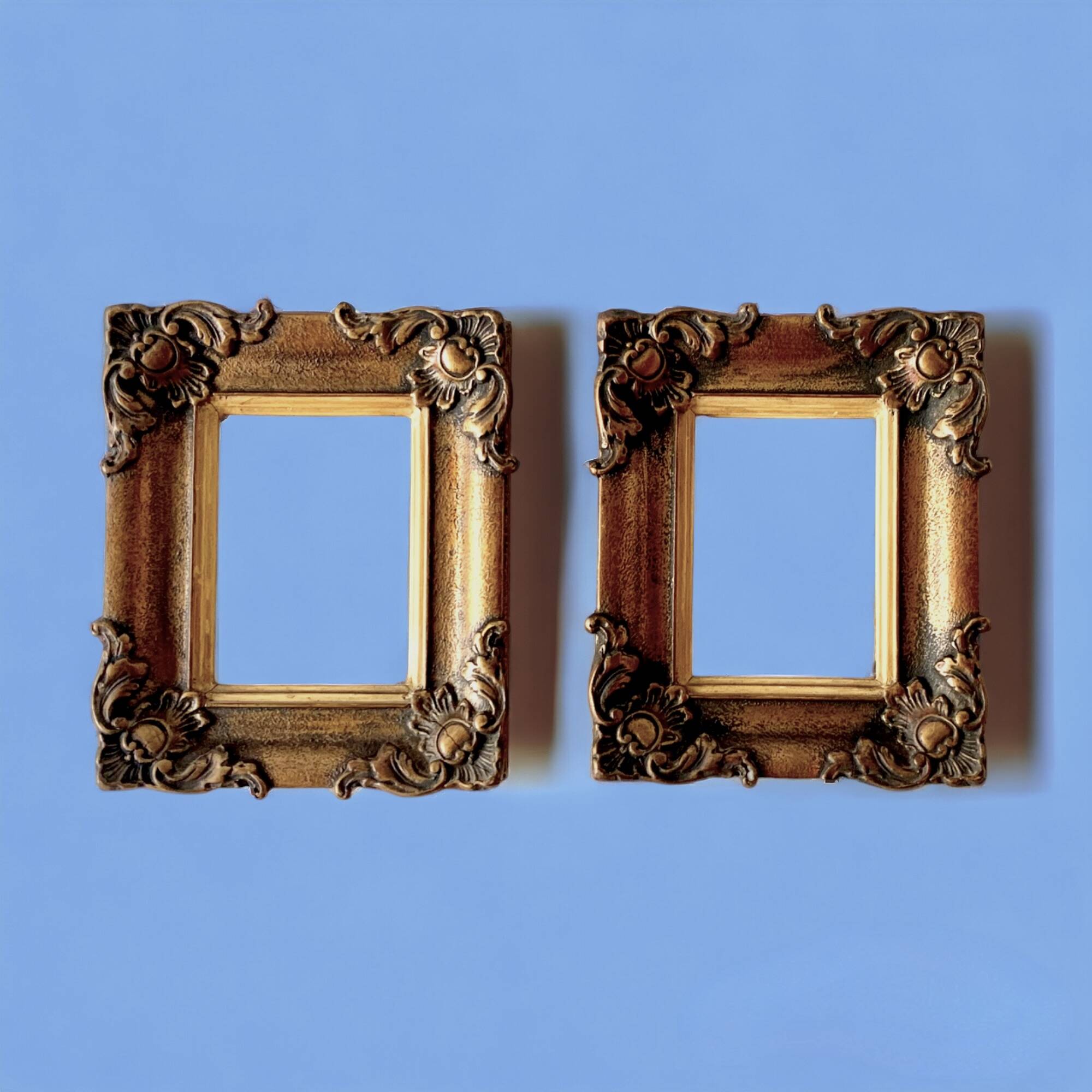 Pair of old carved wooden and plaster frames