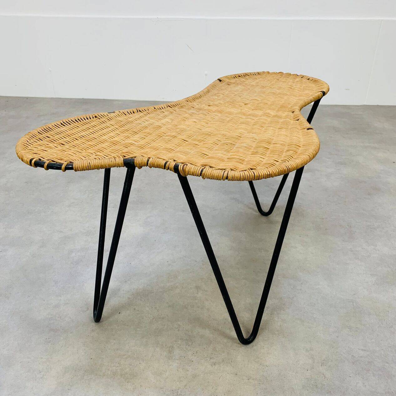 Raoul Guys coffee table, free form, wicker and metal, 1960s.