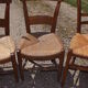 17 old straw chairs