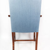 Armchair in mahogany and upholstered with light blue fabric by Fritz Hansen