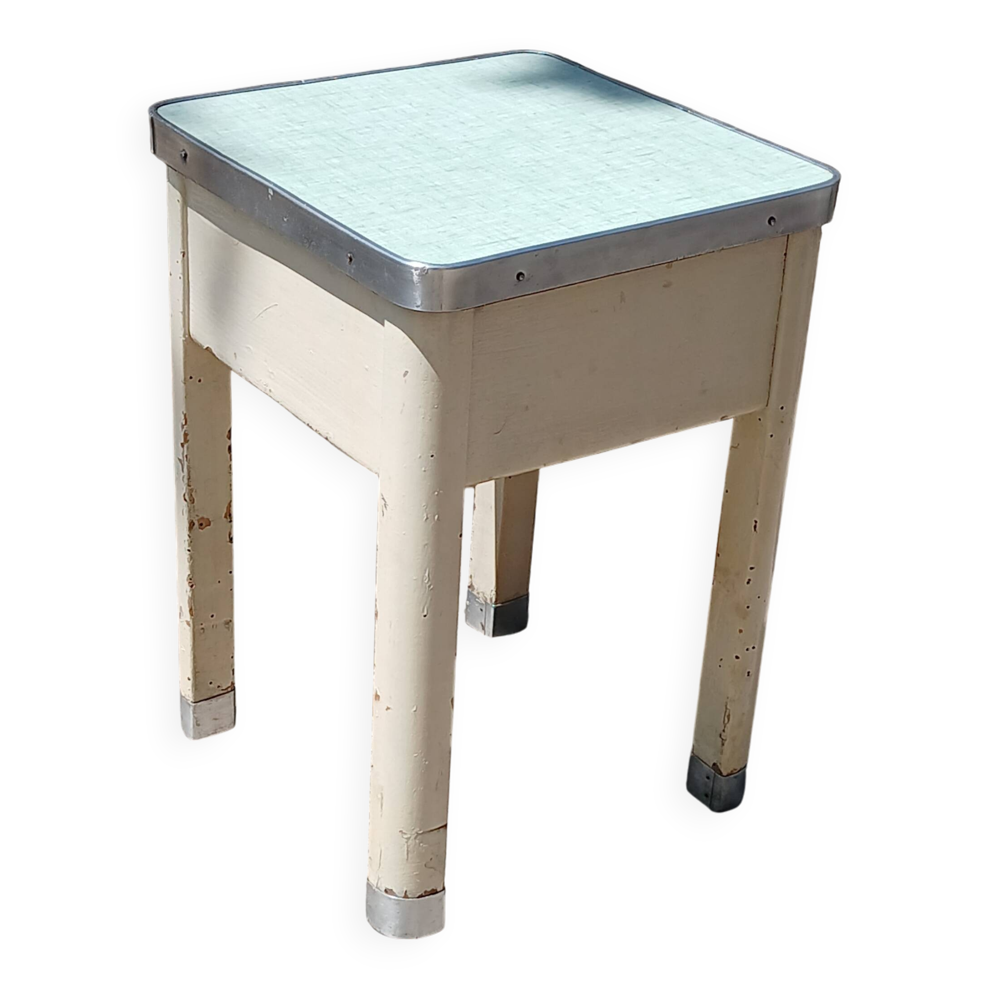 Shoe polish stool with round top and aluminum legs.