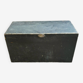 Trunk, black wooden chest and wallpaper