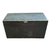 Trunk, black wooden chest and wallpaper
