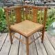 Art Deco corner chair with caning