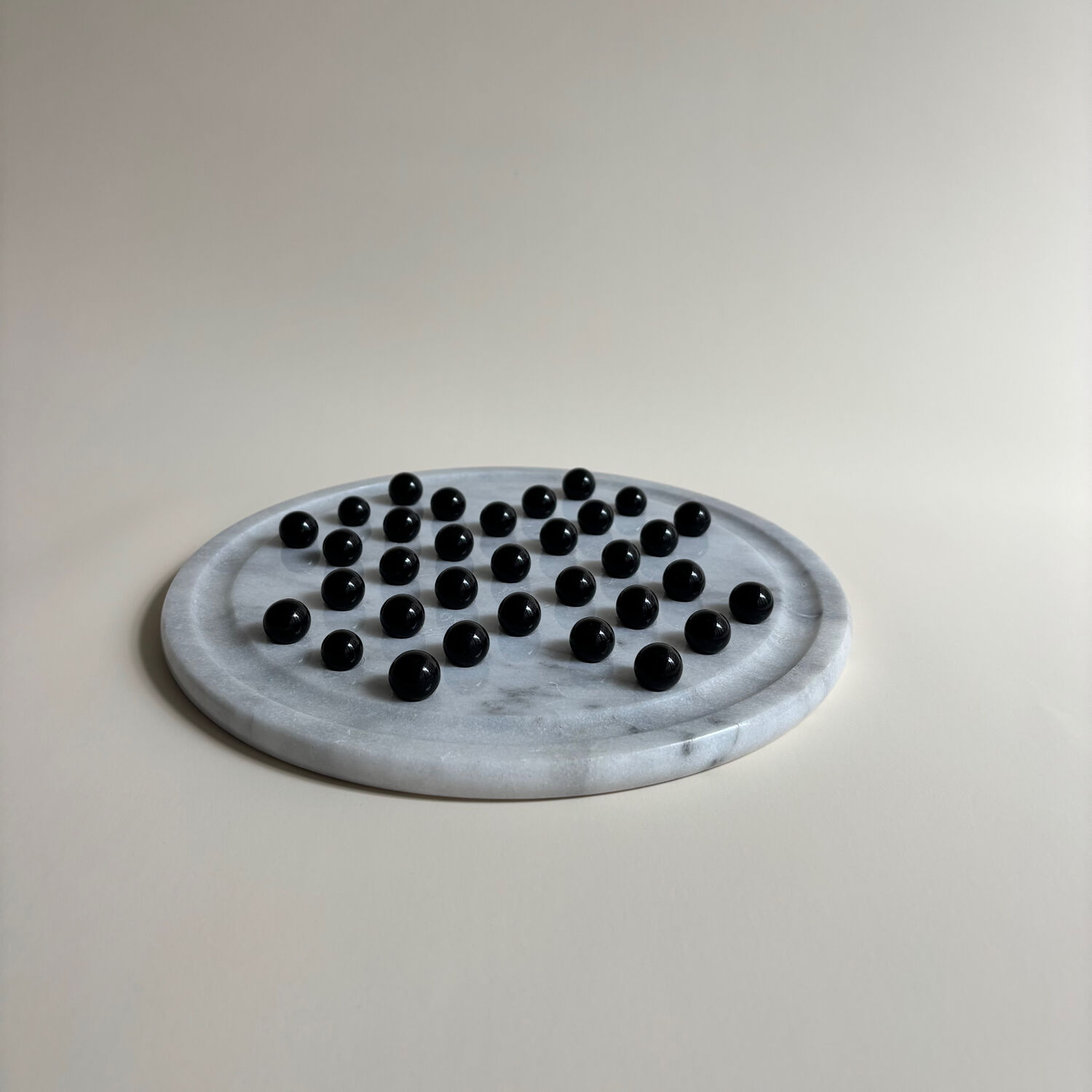 Marble and stone tic-tac-toe games