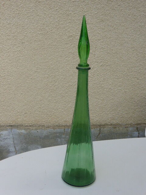 Vintage green faceted glass bottle with its cap 1970