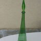 Vintage green faceted glass bottle with its cap 1970