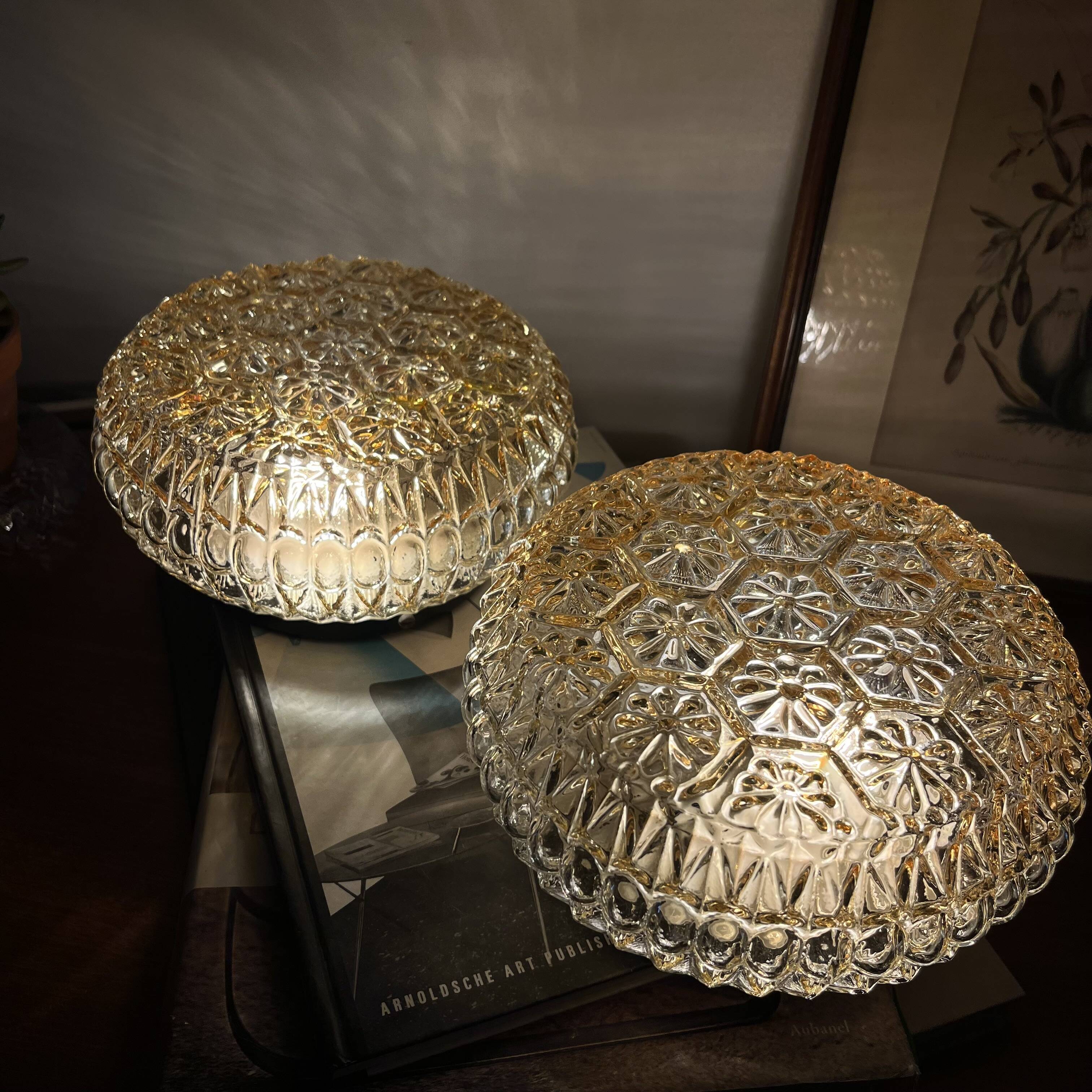 Pair of amber glass ceiling sconces with small vintage flowers.
