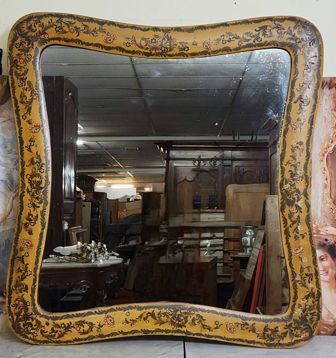 Important rectangular Venetian mirror with a richly painted wooden frame.