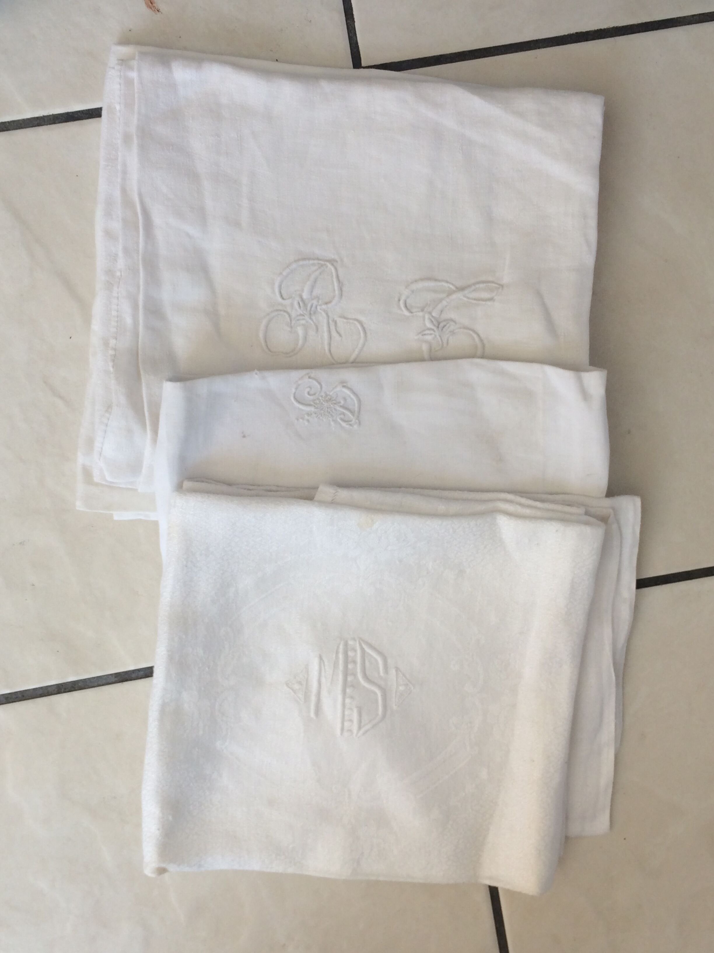 6 old towels damassées with monogram. Mismatched.
