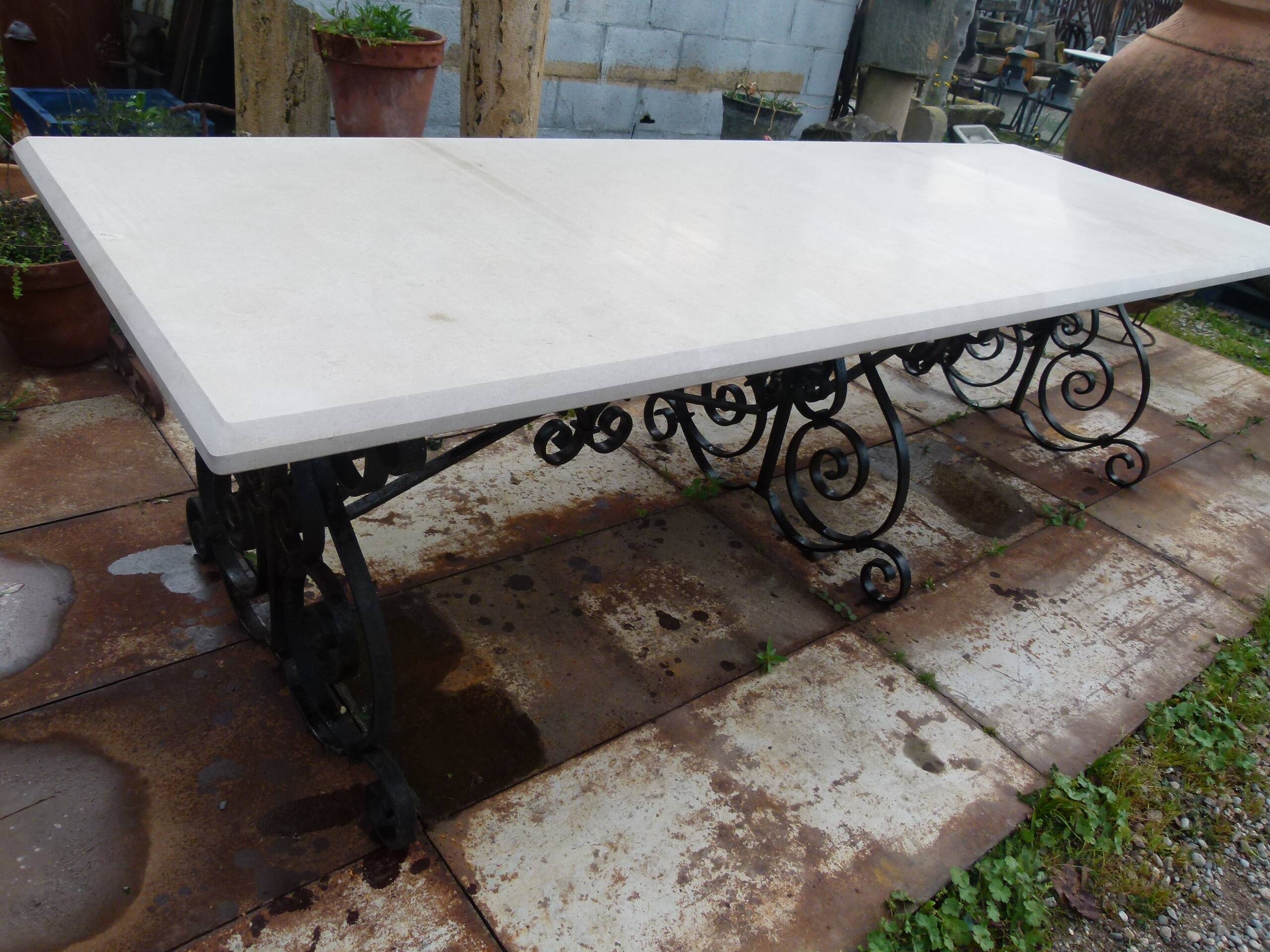 Marble table with wrought iron legs.