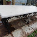 Marble table with wrought iron legs.