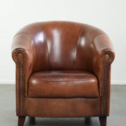 Vintage sheepskin club armchair in English style with deep colours
