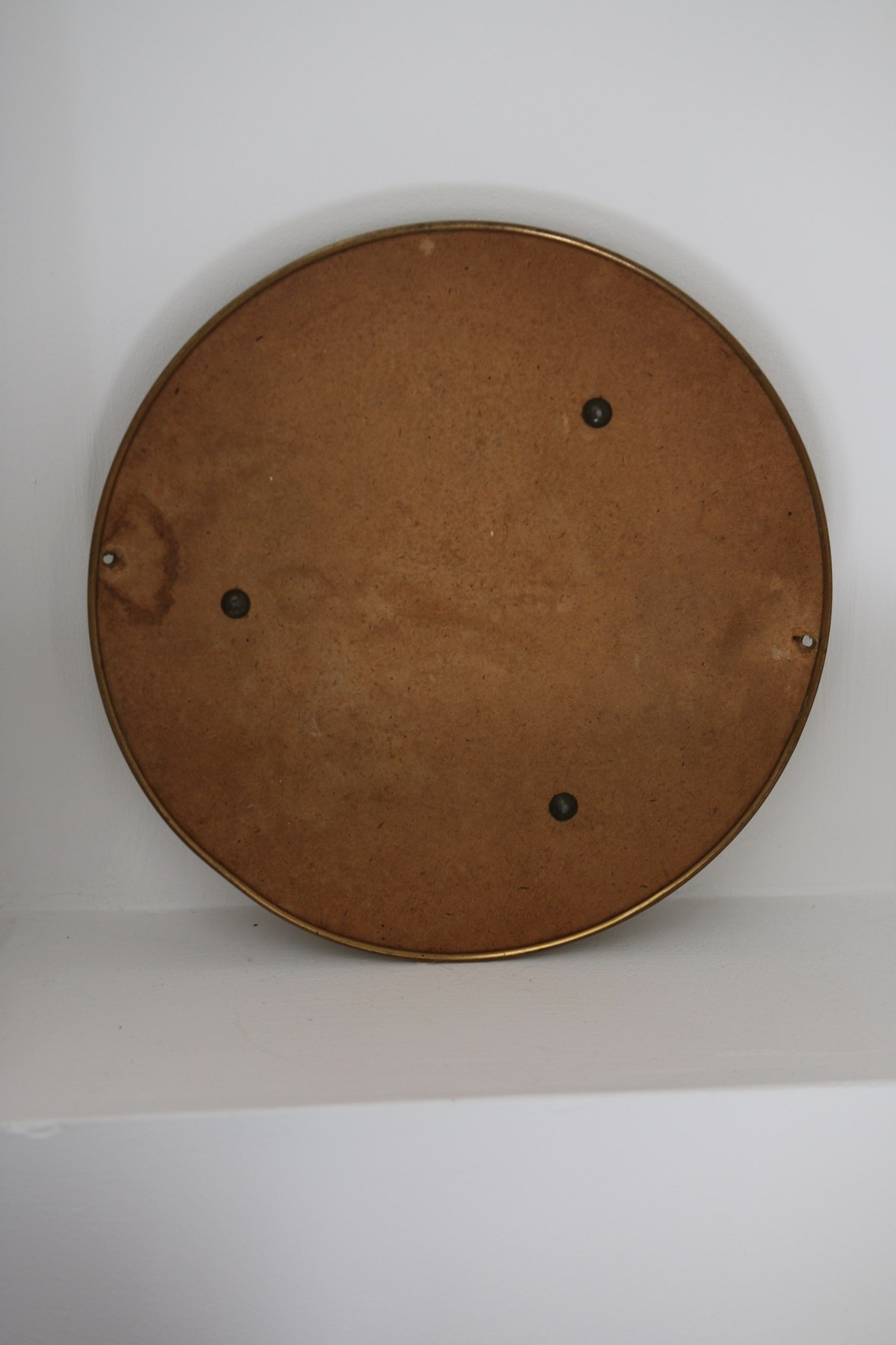 Antique round brass mirror