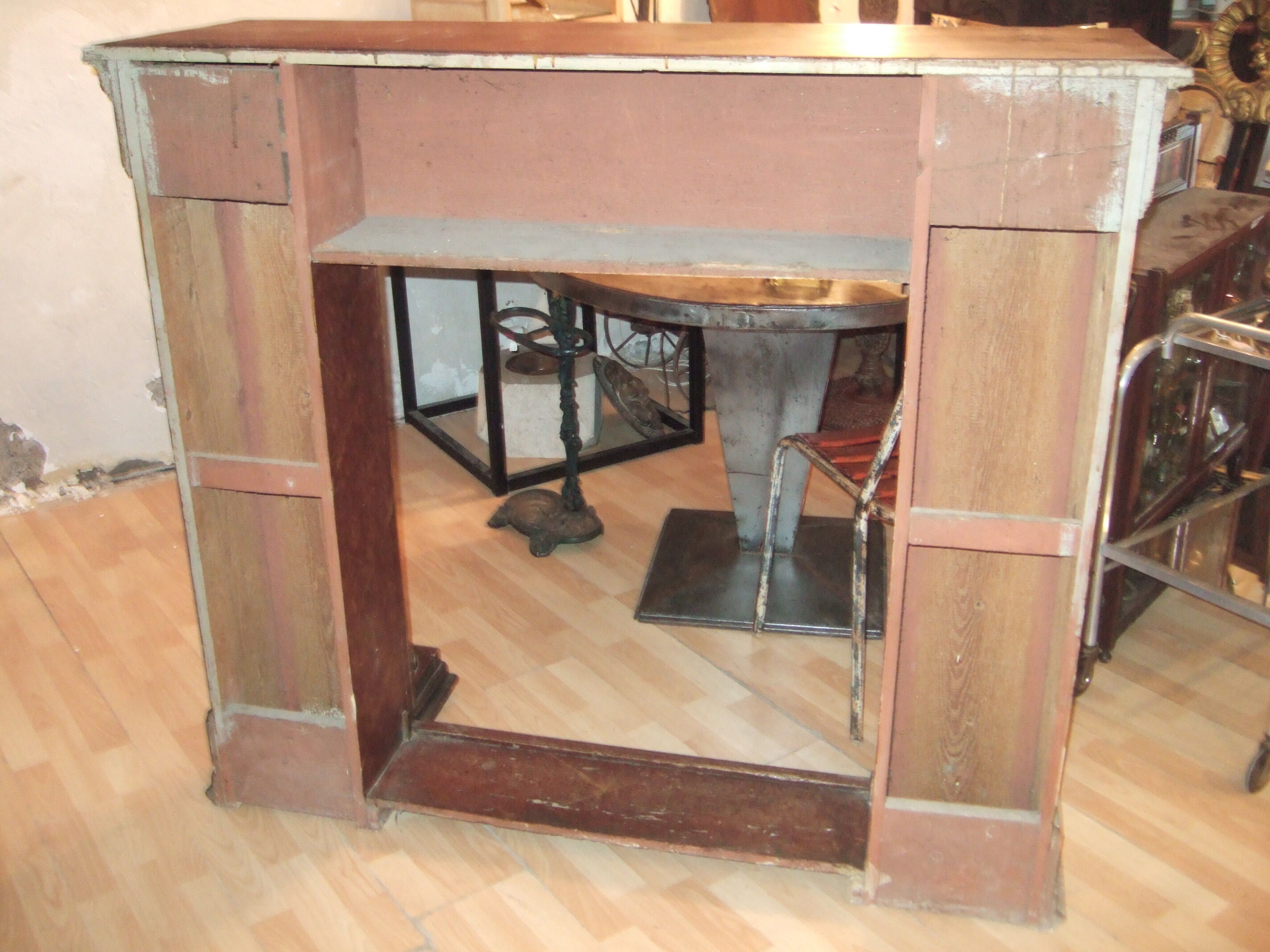 19th century wooden fireplace, faux marble paint. Can act as a console.
