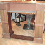 19th century wooden fireplace, faux marble paint. Can act as a console.