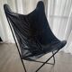 Fauteuil papillon en similicuir en parfait état
