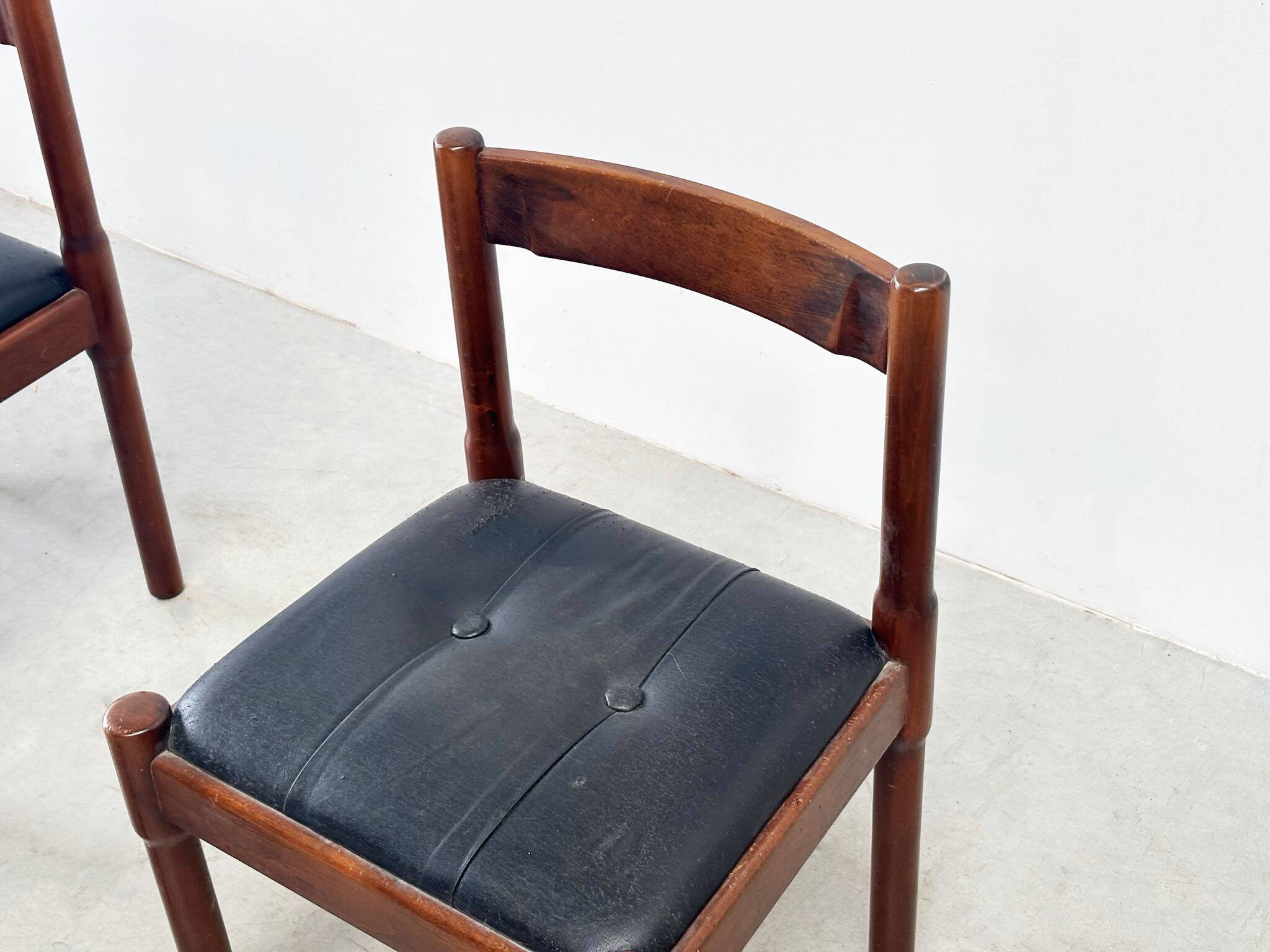 Set of six leather "Carimate" dining chairs by Vico Magistretti for Cassina