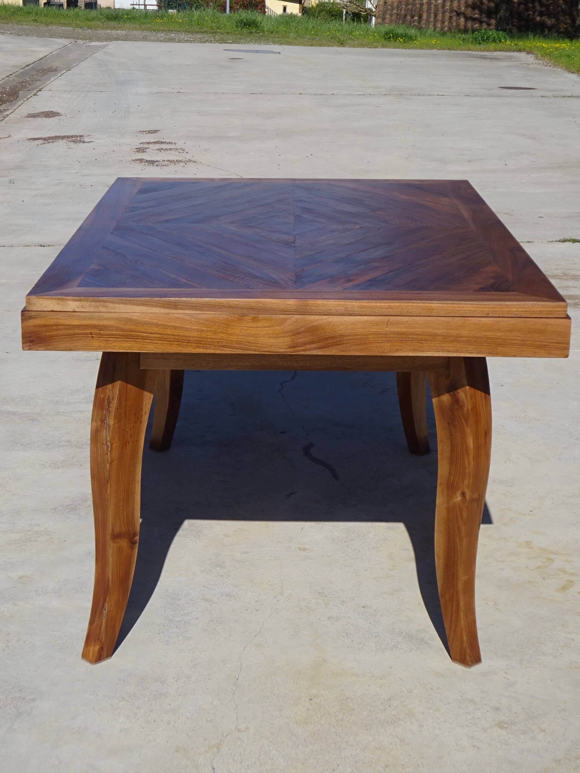 Antique solid walnut table with marquetry and extensions.
