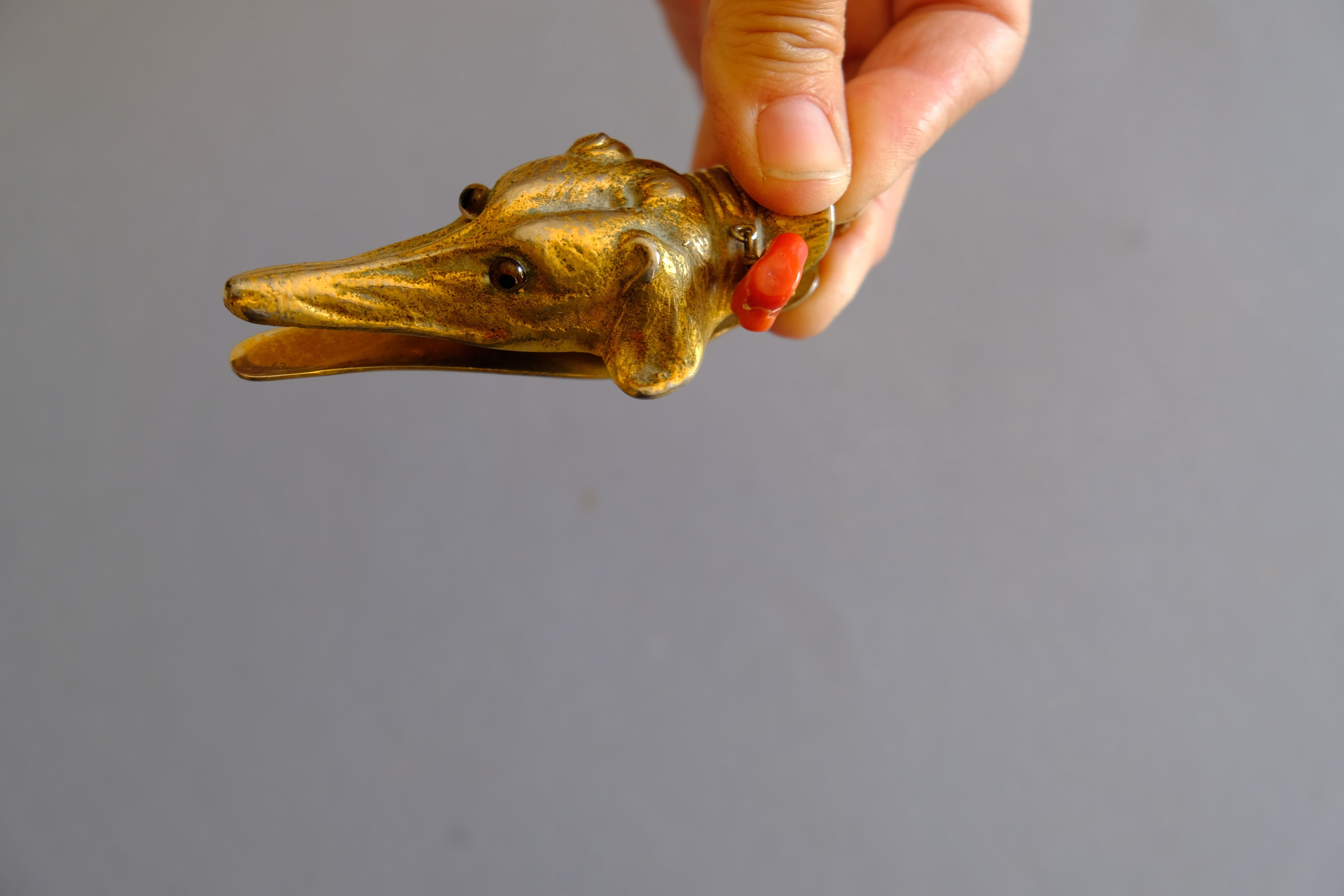 Ancient greyhound-headed mail clip, bronze