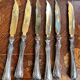 Set of knives and forks for fruits.