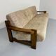 Old 3-seater sofa in solid wood, Maison Regain design, from the 70s.