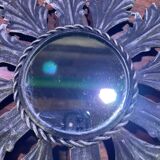 Metal mirror with foliage decoration