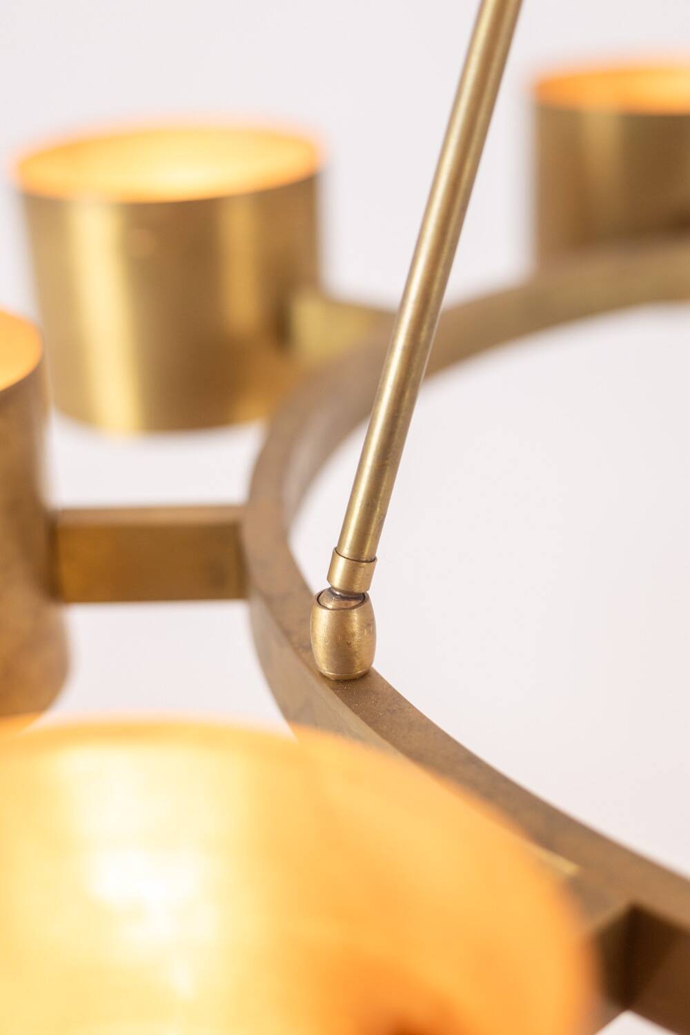 Matte gold brass circular chandelier. Contemporary Italian work.