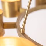 Matte gold brass circular chandelier. Contemporary Italian work.