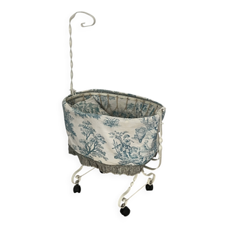 Antique toy, doll's cradle, toile de Jouy fabric.