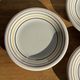 Set of 9 small Italian dessert plates Primula with red and green trim.