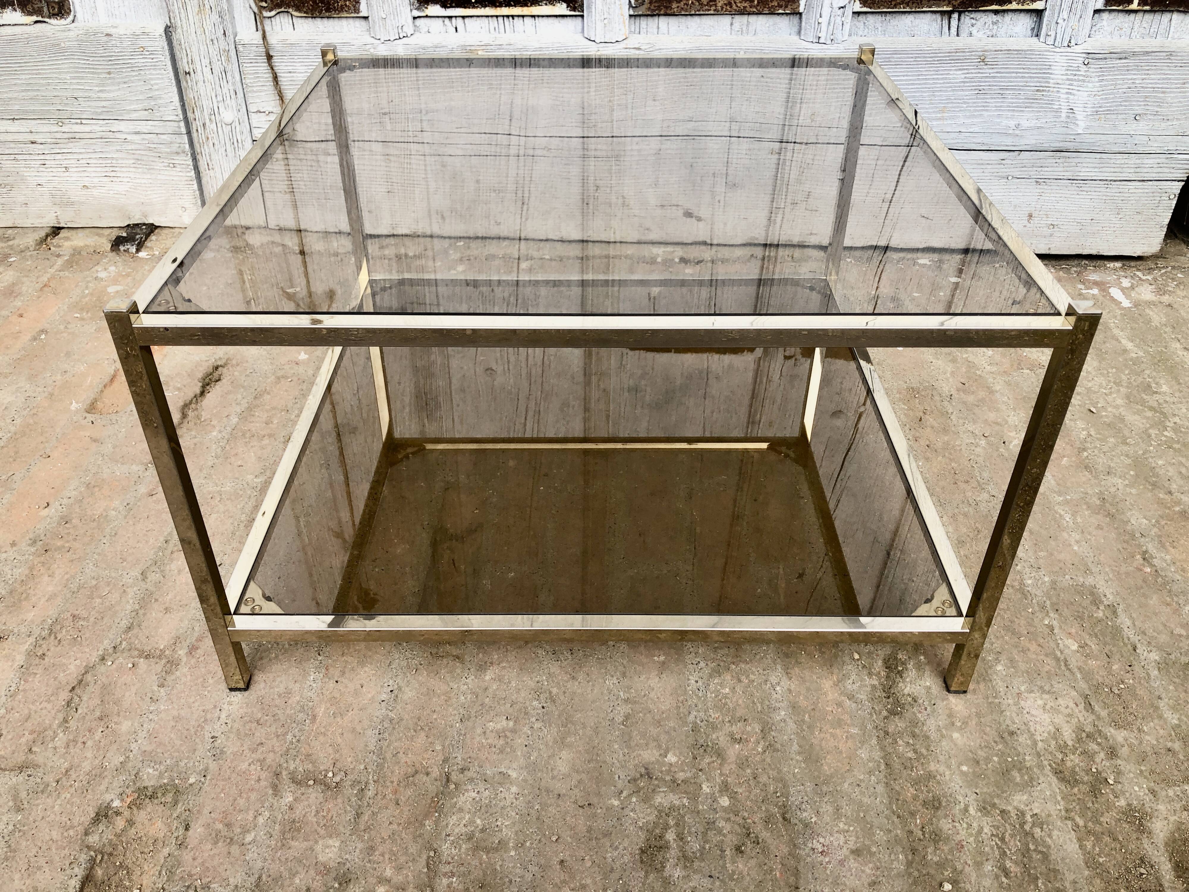 Square brass coffee table and smoked glasses