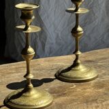 Pair of gilded candlesticks with engraved flower garland motifs H22