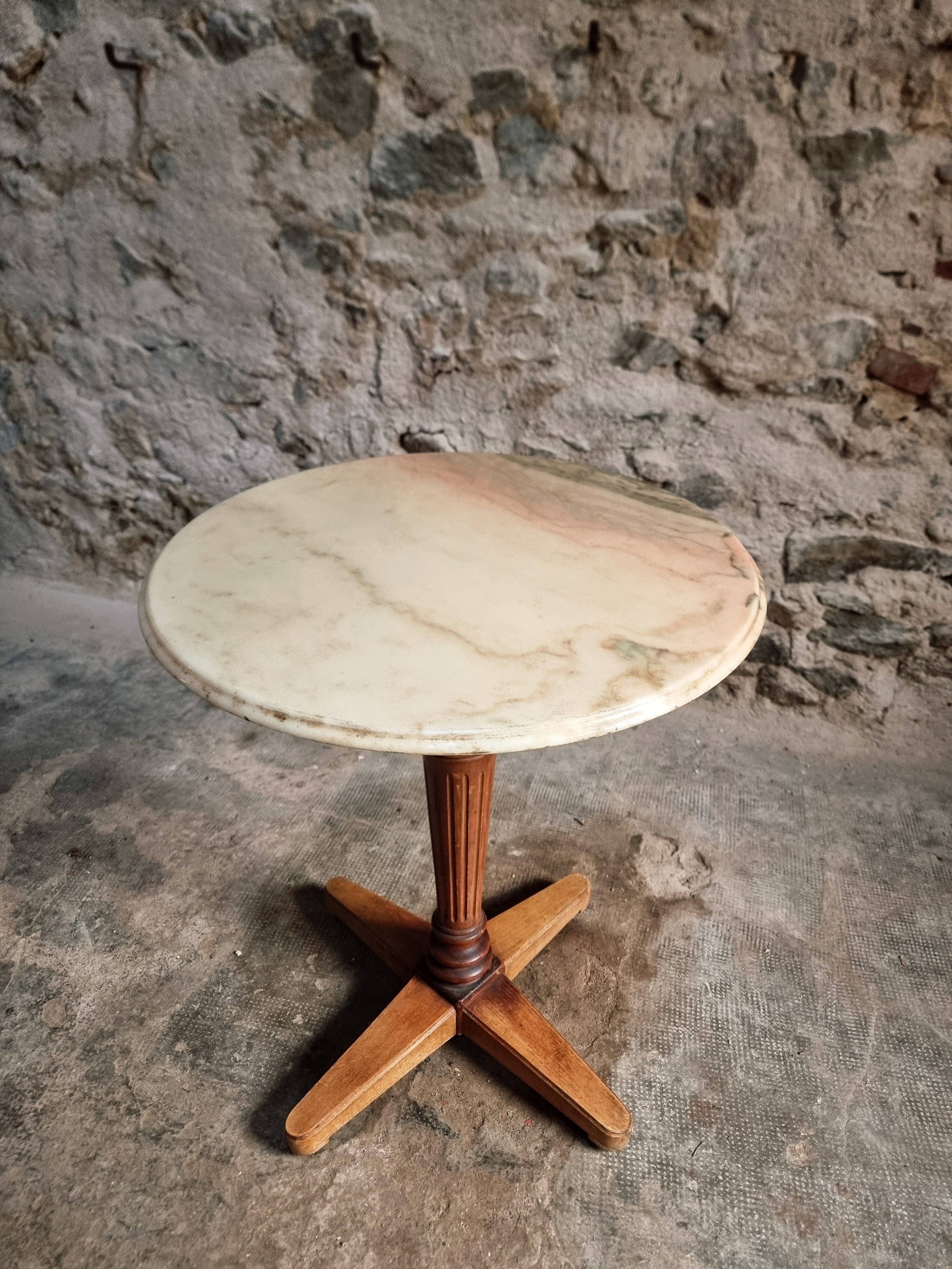 Vintage French bistro table in marble, walnut base, from 1920–1940.