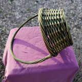 Green wicker basket with a large vintage handle