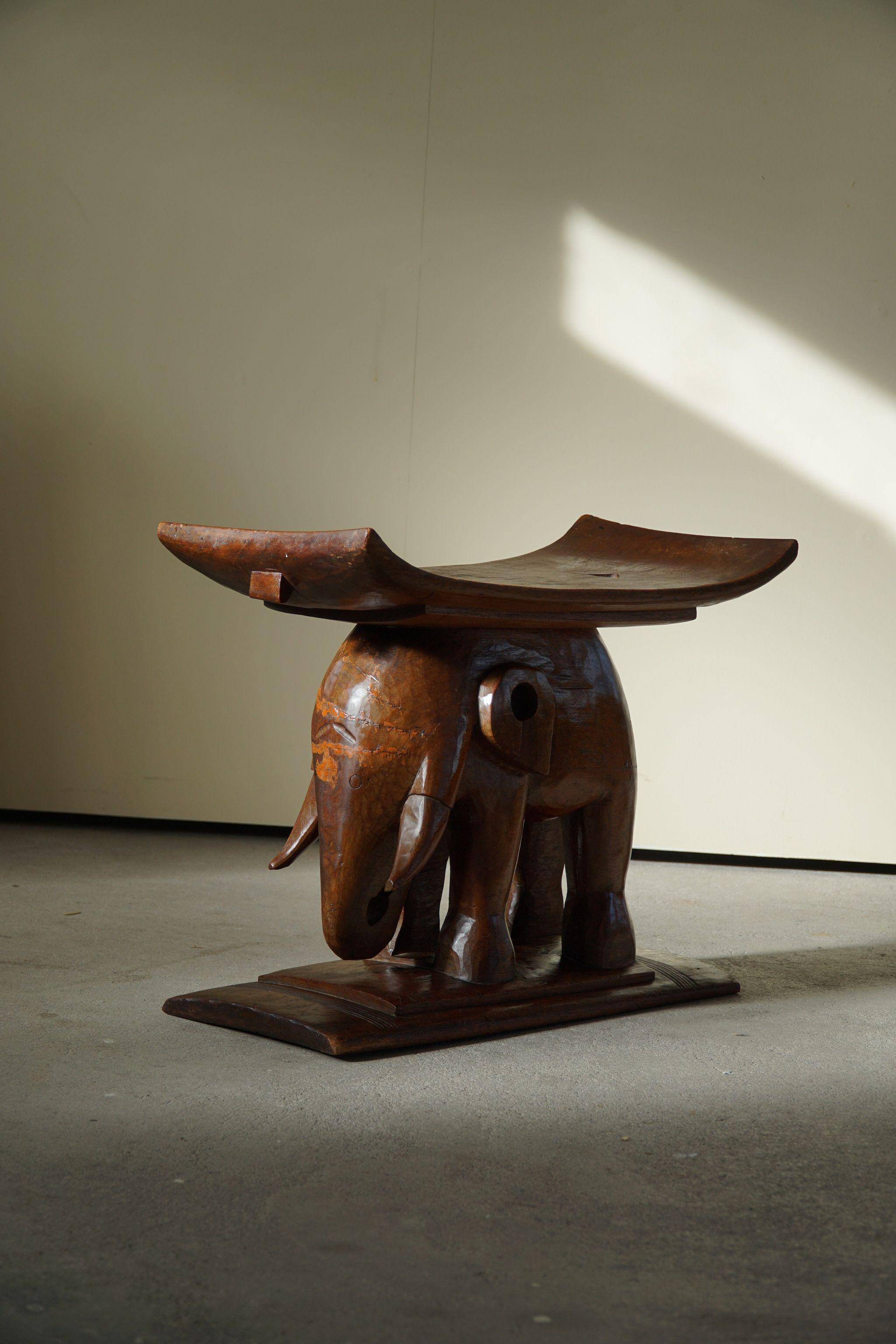 African elephant stool in carved wood, mid-century in Wabi Sabi style, 1940s.