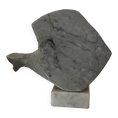 Marble sculpture in the shape of a fish.