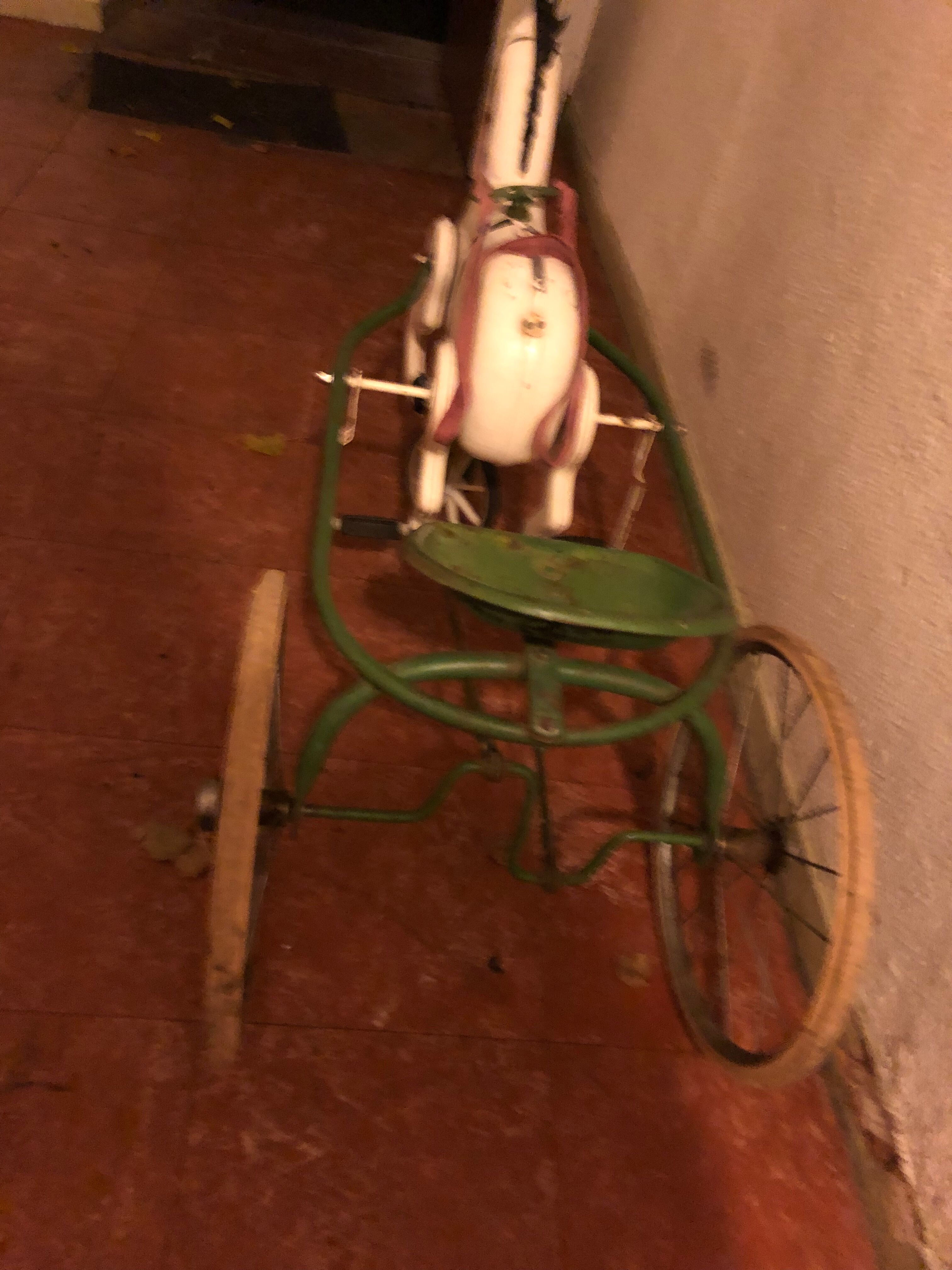 Old pedal horse with sulky