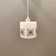 Scandinavian hanging lamp in white glass with inlayed black motifs.