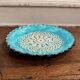 20th century blue enamel plate decorated with lace