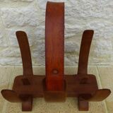 Unique piece of a magazine rack or log rack in solid oak pegged with leather handle