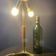 Elegant table lamp with a slender teak body on a tripod brass base, Germany, 1960s.