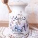Old large vintage stoneware olive pot with its wooden spoon