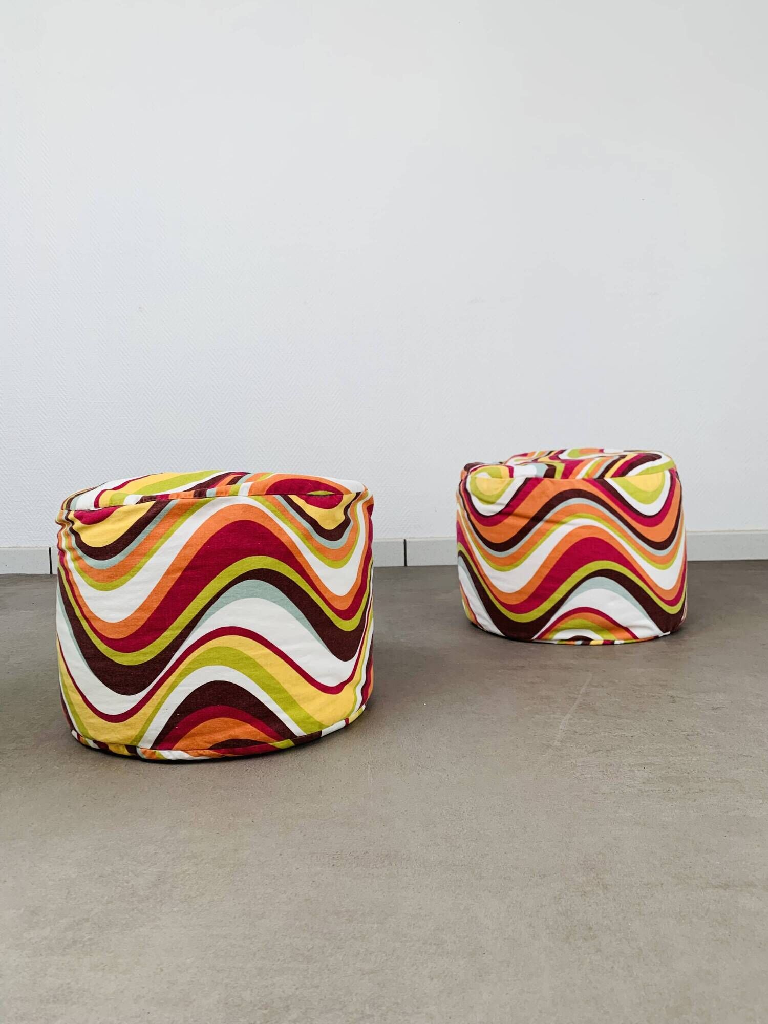 Pair of "psychedelic" fabric poufs from the 70s.