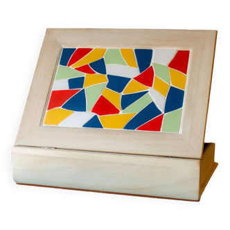 White wooden boxes decorated with Catalan trencadís style mosaics