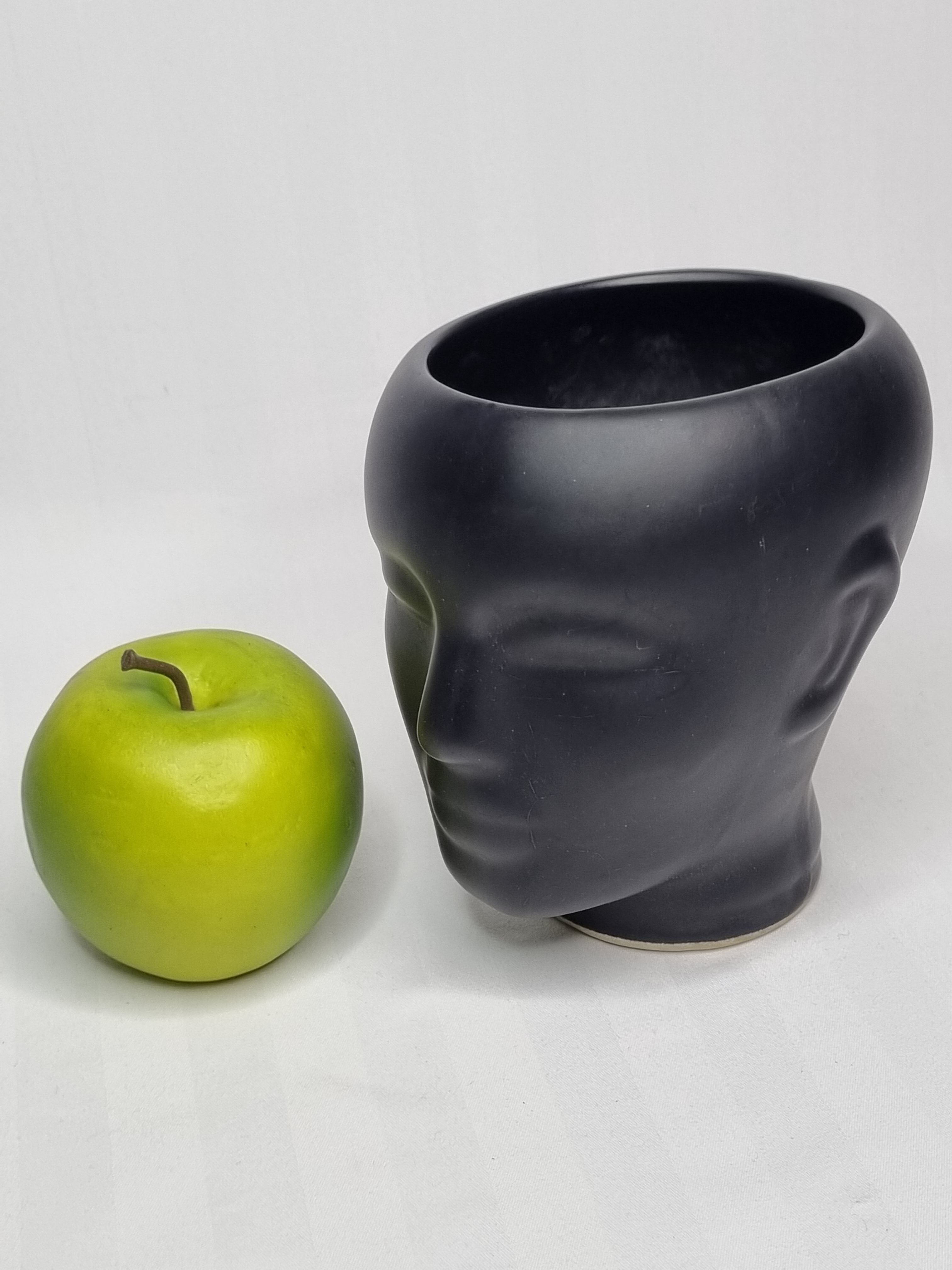Anthropomorphic pot cover in matt black glazed ceramic, 80s