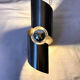 Brushed stainless steel wall light by Oxar France