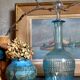 Blue glass carafe with vintage pegs
