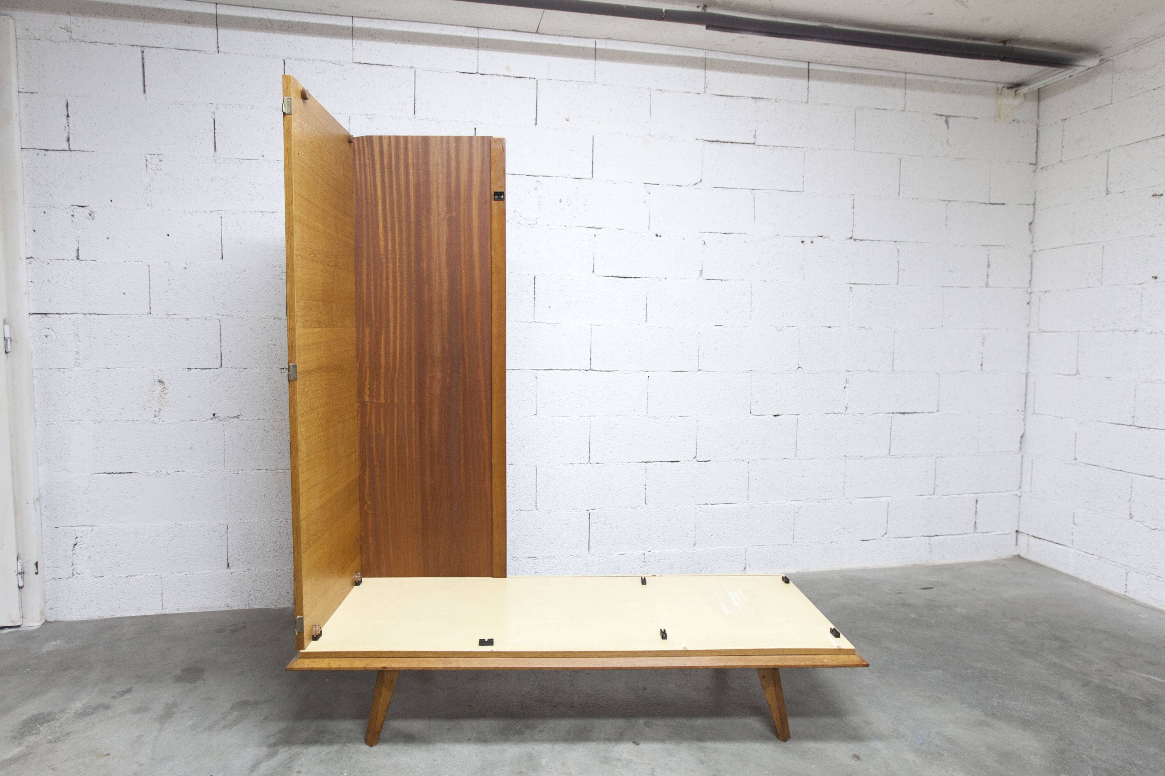 French wardrobe with tapered legs, 3 doors, 1 mirror (27*130), and 1 drawer.