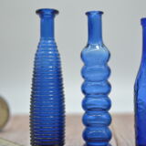 Set of 4 blue bottles of decoration